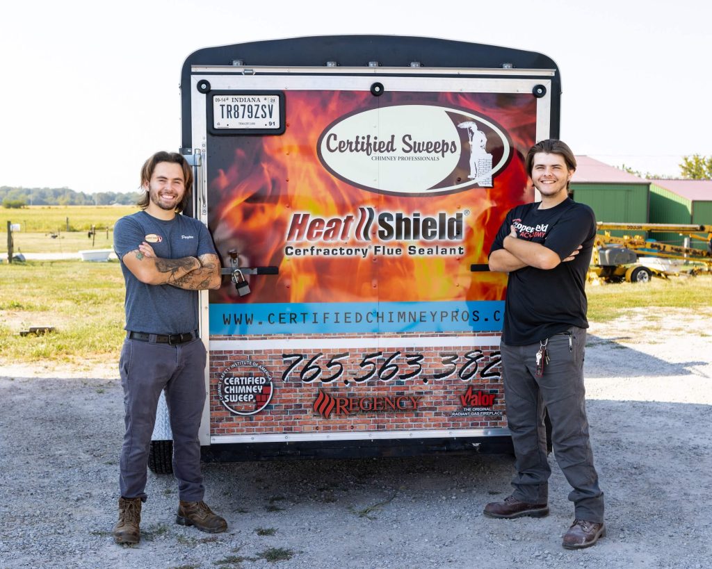 Chimney cleaning service truck with 2 employees